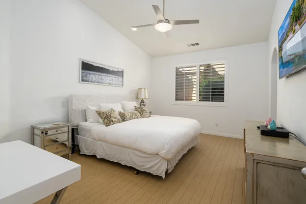 a bedroom with bed and a window