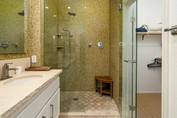 a bathroom with a sink toilet and shower