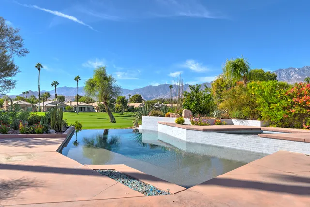 a view of a swimming pool with a patio