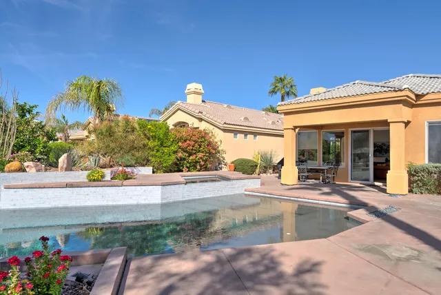 a view of a house with outdoor space and sitting area