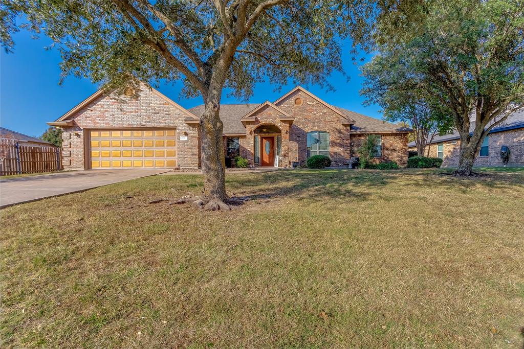 226 King George Road Ponder, TX 76259 - Photo 4 of 39 Ranch-style home with driveway, brick siding, and an attached garage