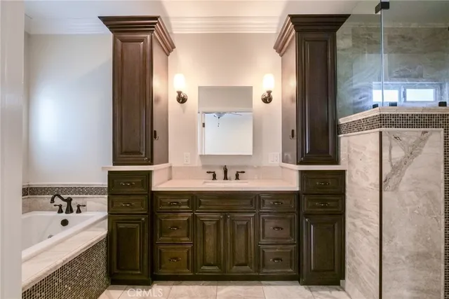 a bathroom with a bathtub sink and mirror