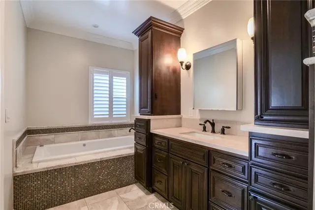 a bathroom with a bathtub and a sink