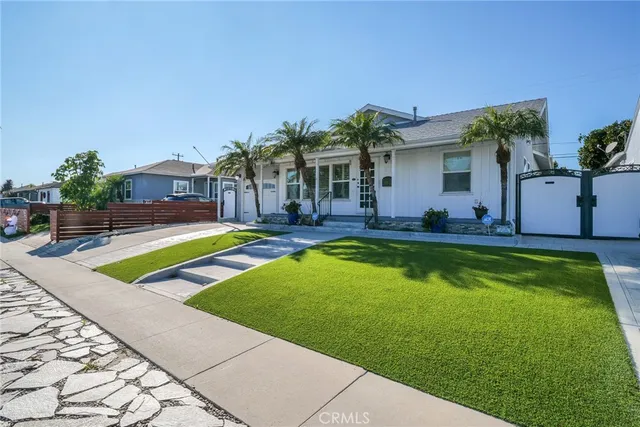 a view of a house with swimming pool yard and porch