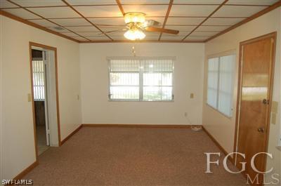12128 Dolphin Road Bokeelia, FL 33922 - Photo 5 of 6 a view of an empty room with a window