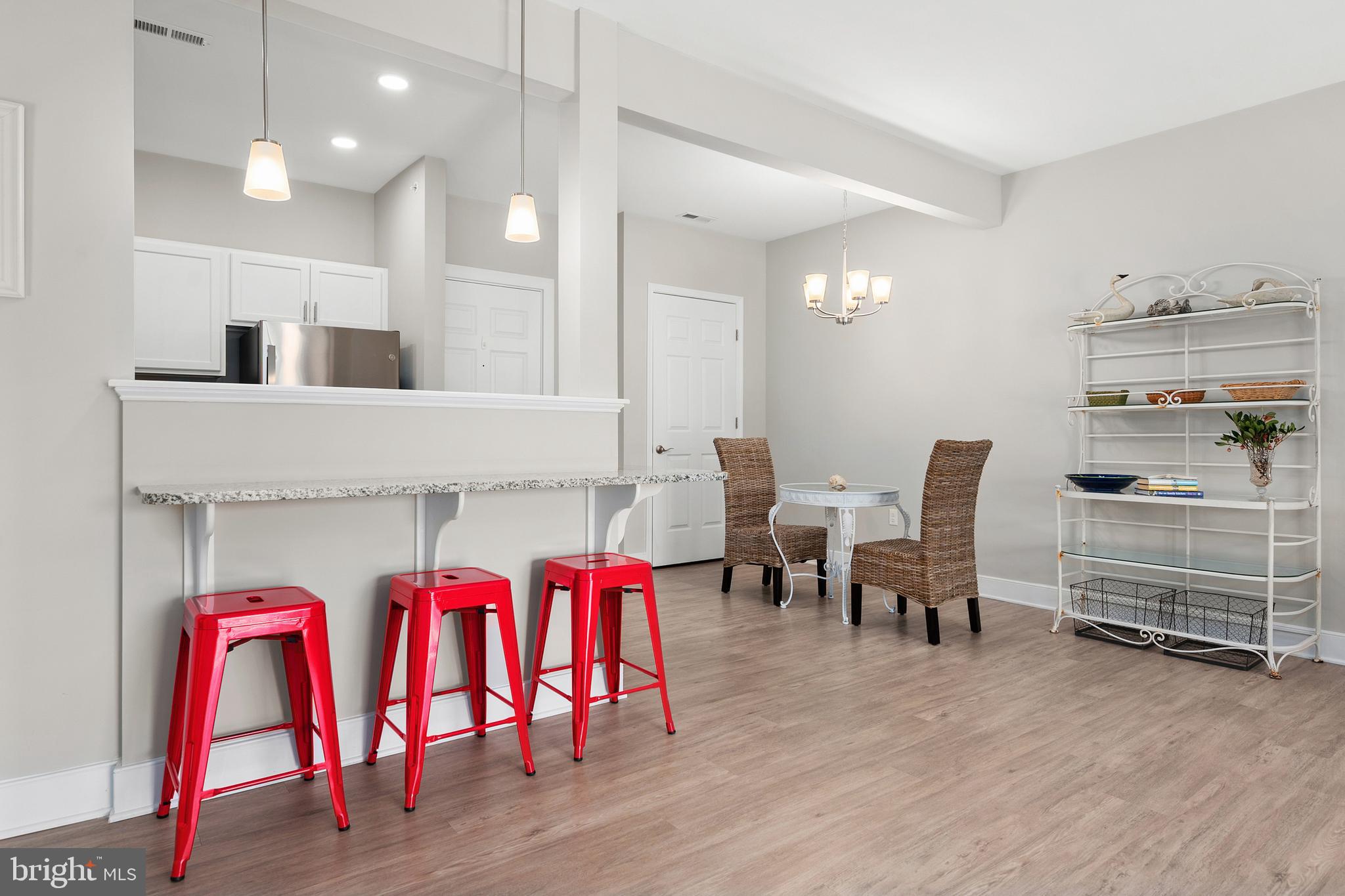 30609 Cedar Neck Road, Unit 3108 Ocean View, DE 19970 - Photo 11 of 42 a room with gym equipment and wooden floor