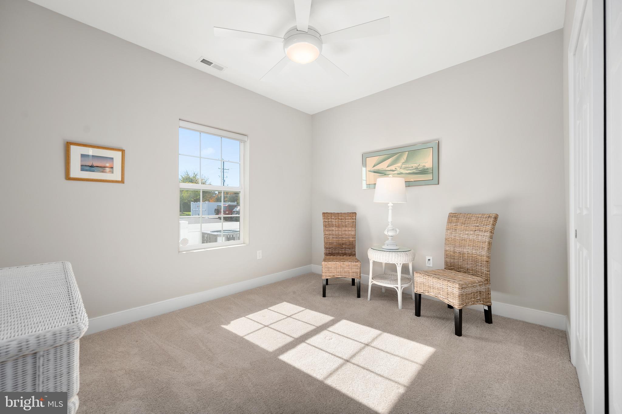 30609 Cedar Neck Road, Unit 3108 Ocean View, DE 19970 - Photo 23 of 42 a living room with furniture and a window
