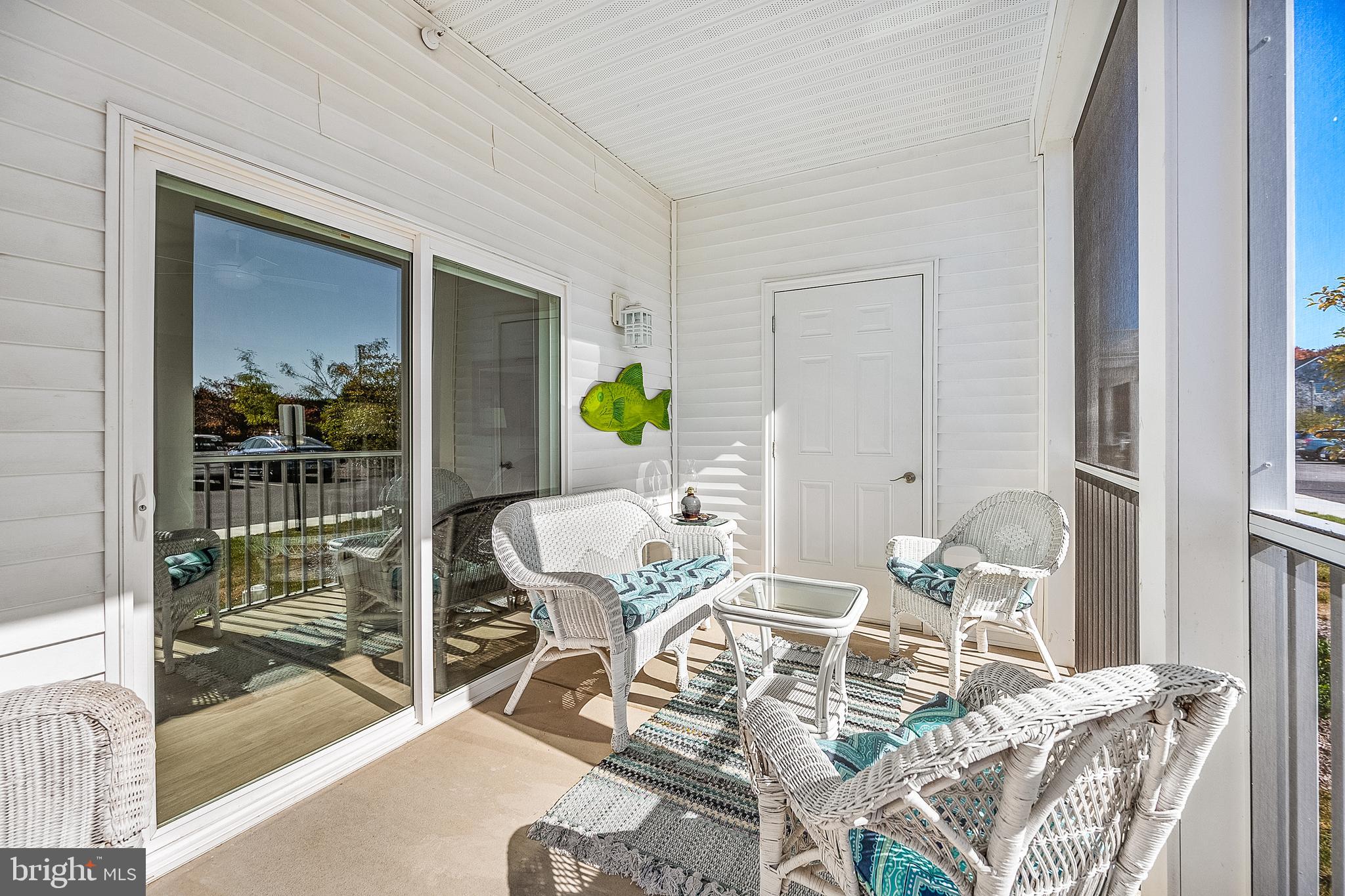 30609 Cedar Neck Road, Unit 3108 Ocean View, DE 19970 - Photo 28 of 42 a view of a dining room with a table and chairs