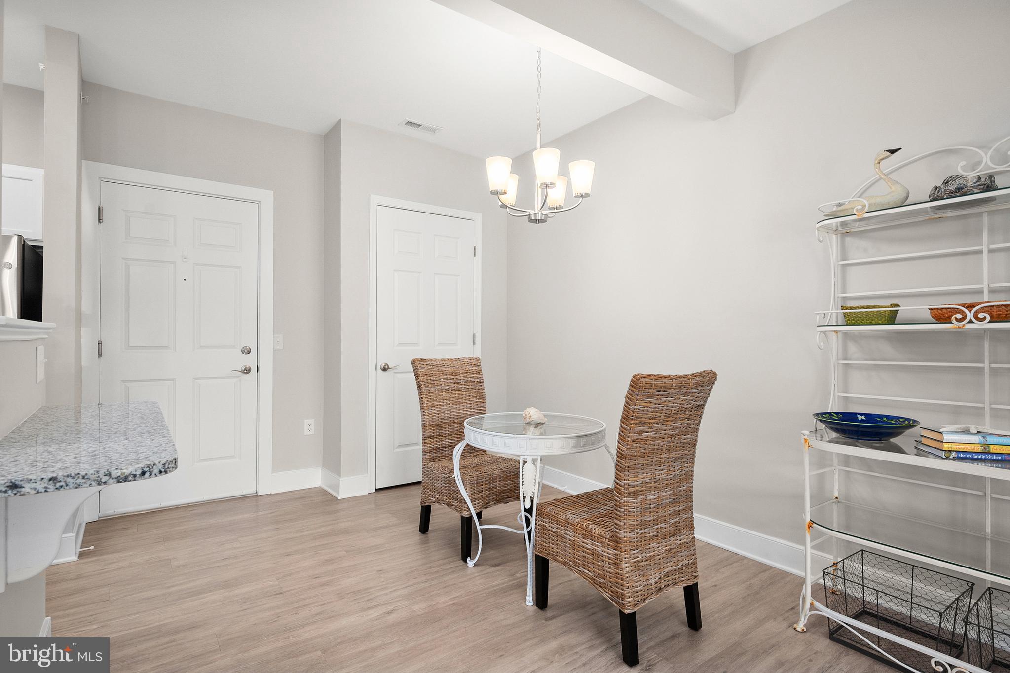 30609 Cedar Neck Road, Unit 3108 Ocean View, DE 19970 - Photo 4 of 42 a view of a livingroom with furniture and chandelier