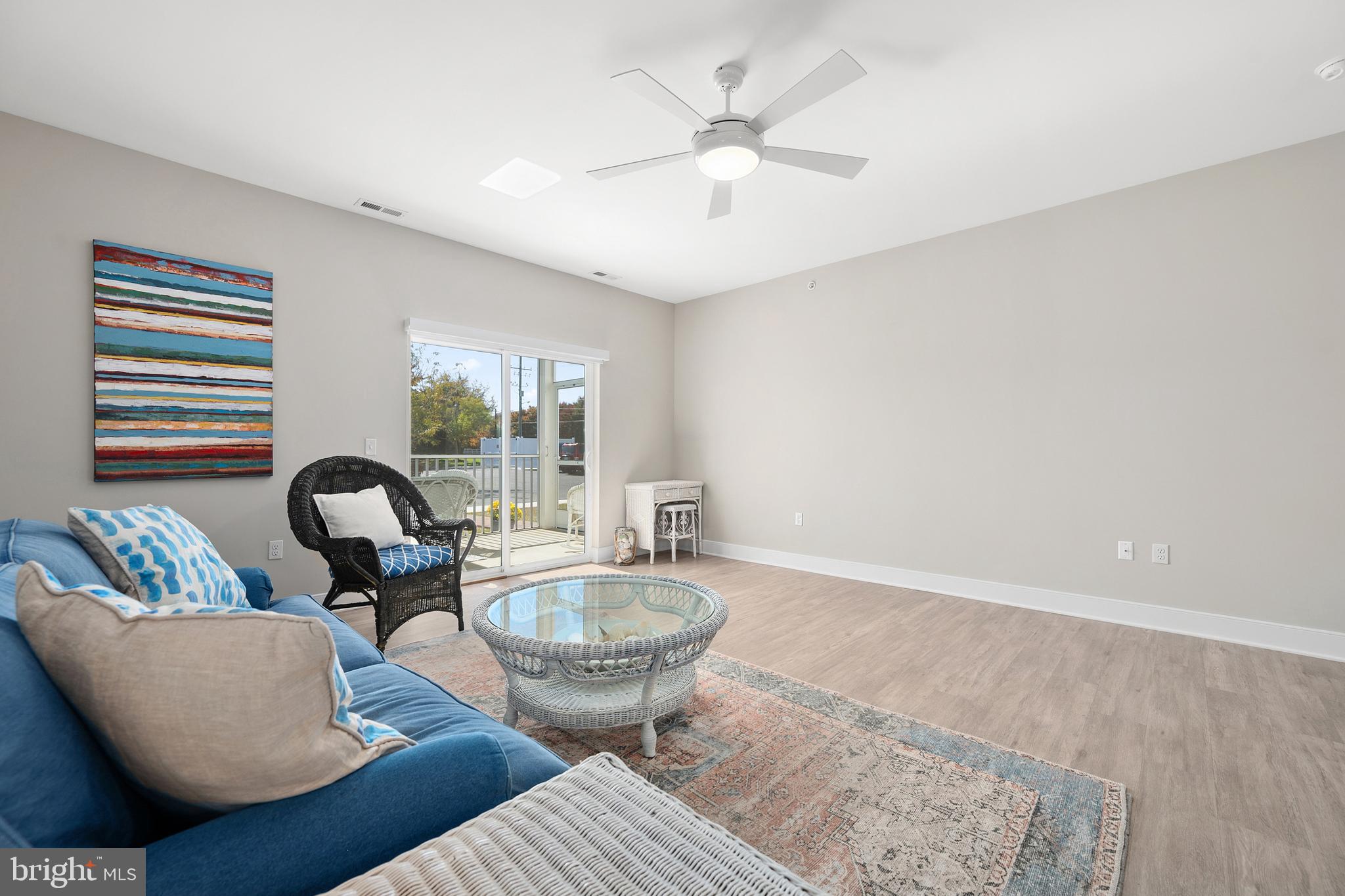 30609 Cedar Neck Road, Unit 3108 Ocean View, DE 19970 - Photo 7 of 42 a living room with furniture and a table