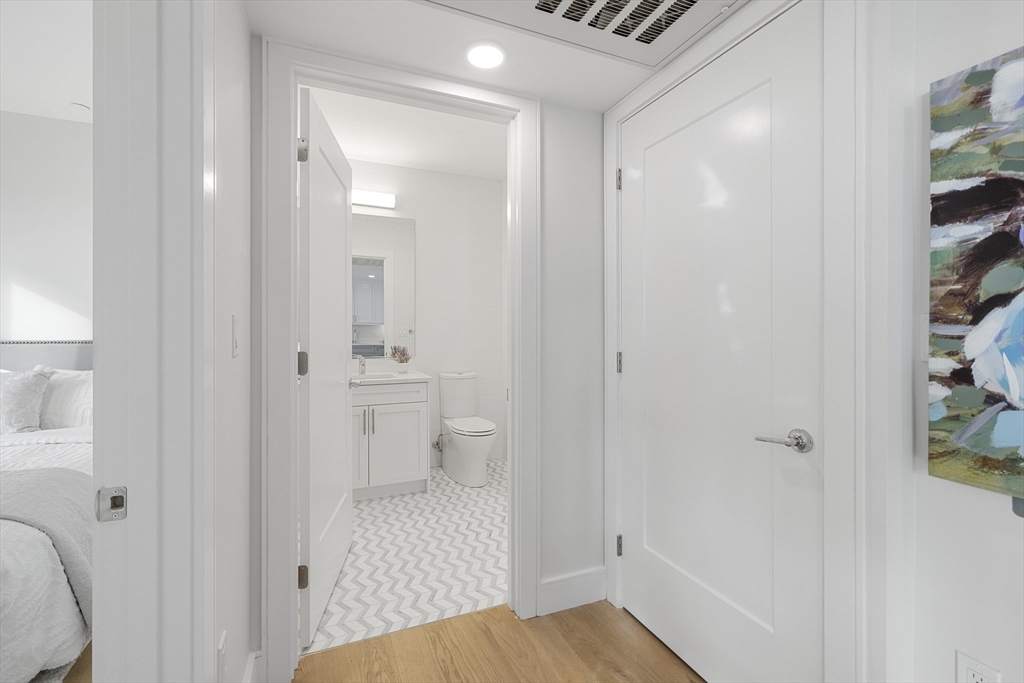301 Border Street, Unit 611 Boston, MA 02128 - Photo 15 of 32 a bathroom with a sink and a toilet