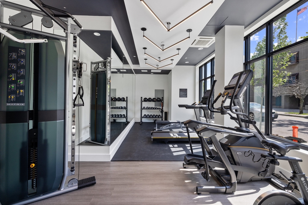 301 Border Street, Unit 611 Boston, MA 02128 - Photo 31 of 32 a view of a room with lots of gym equipment
