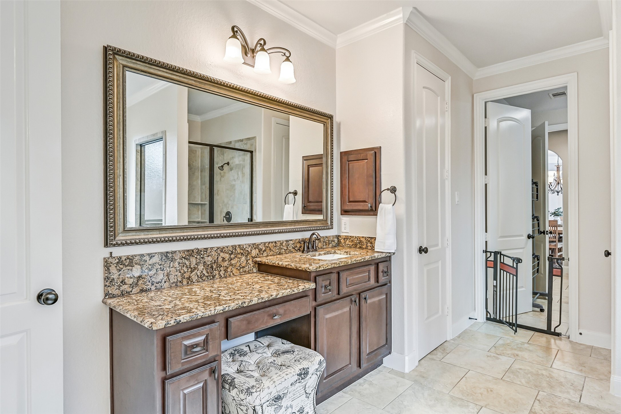 1008 Point Isabel Lane Friendswood, TX 77546 - Photo 31 of 50 The extended vanity offers excellent prep space and storage, while the adjoining walk-in closet has been fully customized with a built-in organization system designed to maximize storage and functionality.