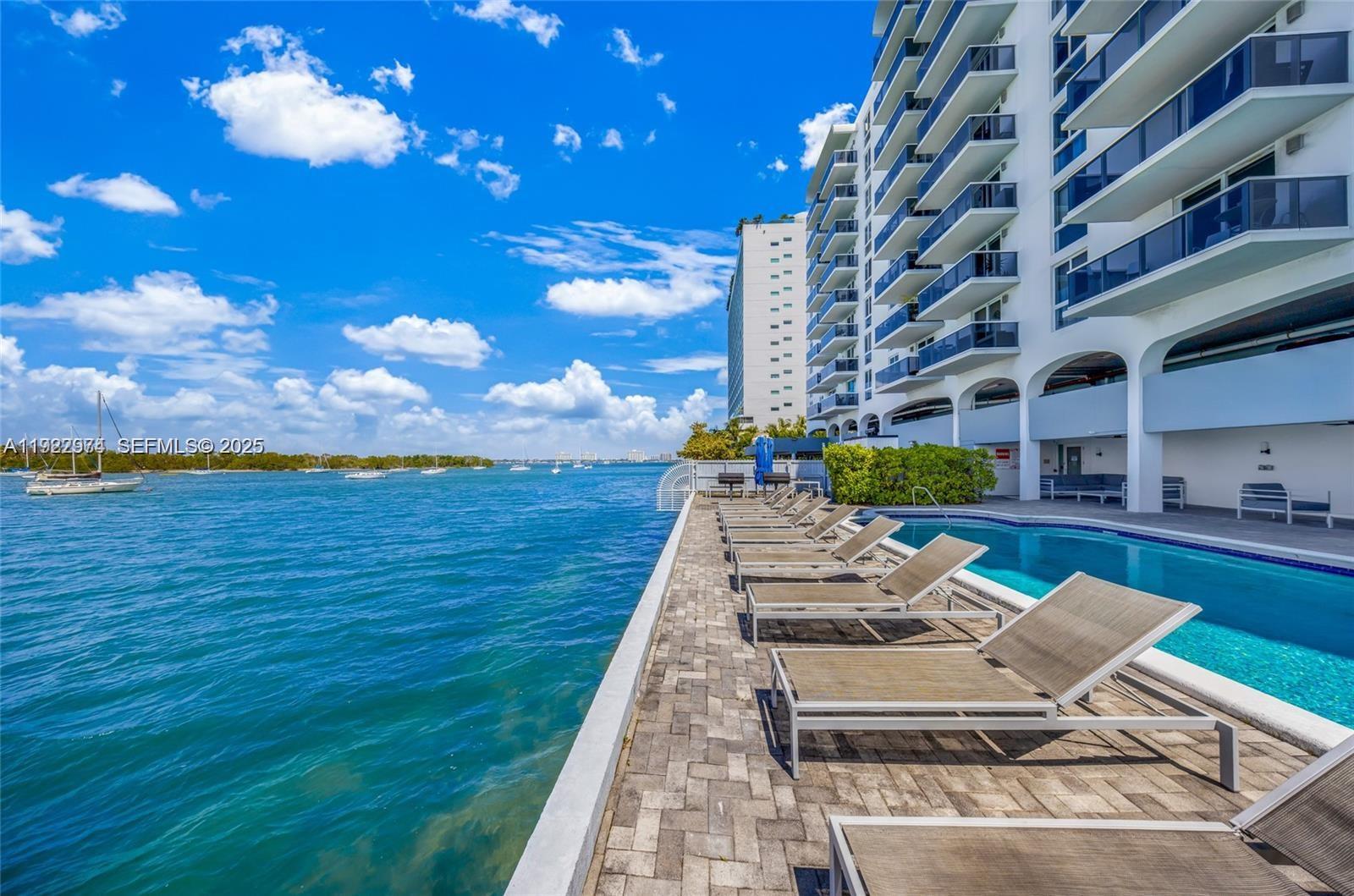 7928 West Drive, Unit 602 North Bay Village, FL 33141 - Photo 1 of 44 a view of an ocean with seating space