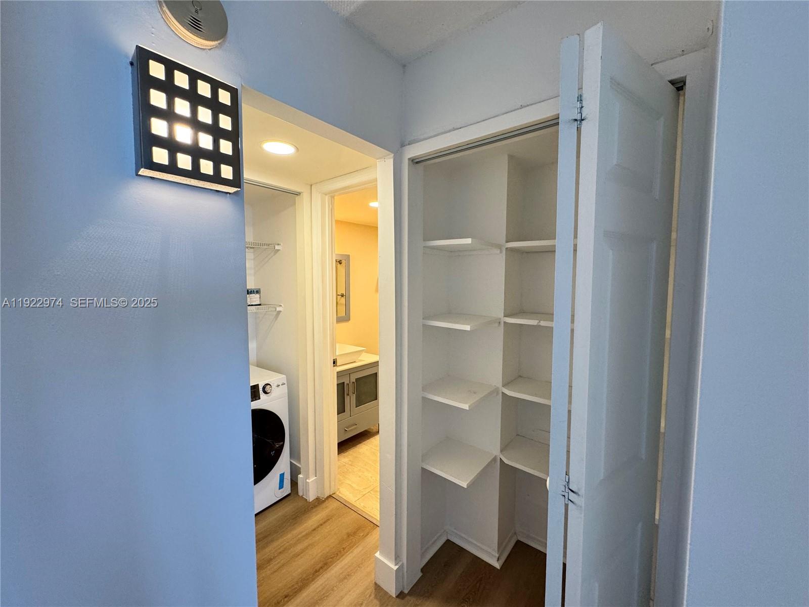 7928 West Drive, Unit 602 North Bay Village, FL 33141 - Photo 14 of 44 a view of entryway with wooden floor and cabinet