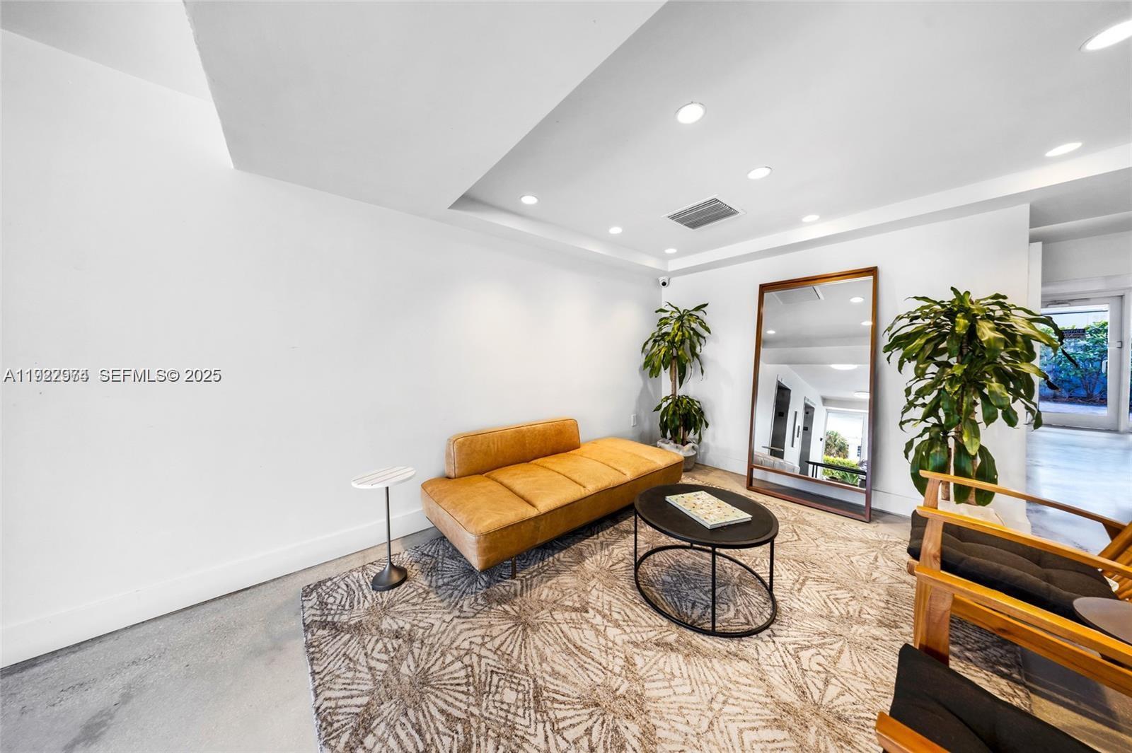 7928 West Drive, Unit 602 North Bay Village, FL 33141 - Photo 25 of 44 a living room with furniture a rug and white walls