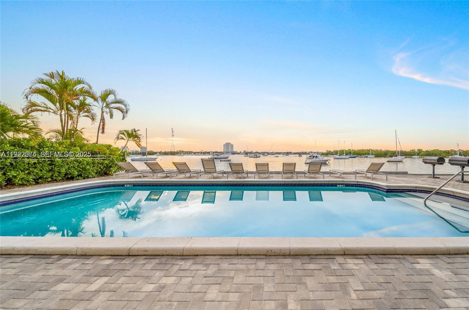 7928 West Drive, Unit 602 North Bay Village, FL 33141 - Photo 31 of 44 a roof deck with a couple of lawn chairs