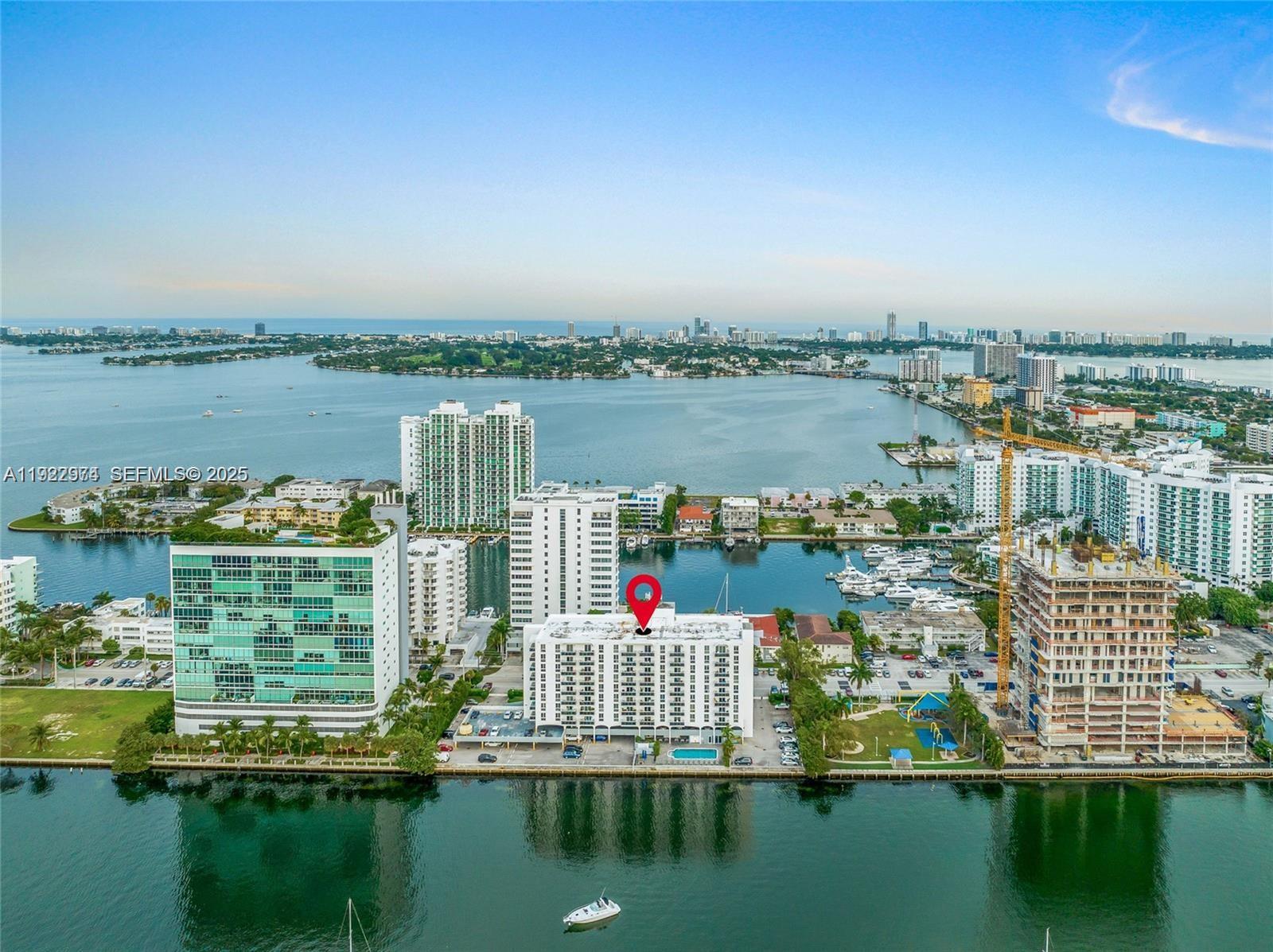 7928 West Drive, Unit 602 North Bay Village, FL 33141 - Photo 37 of 44 a city view from a lake