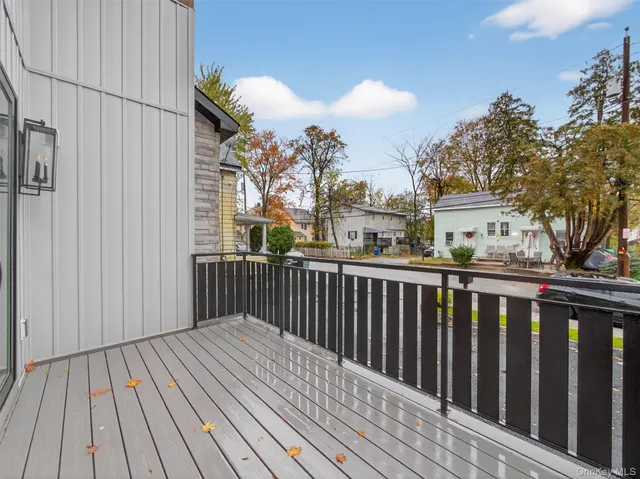 a balcony with wooden floor