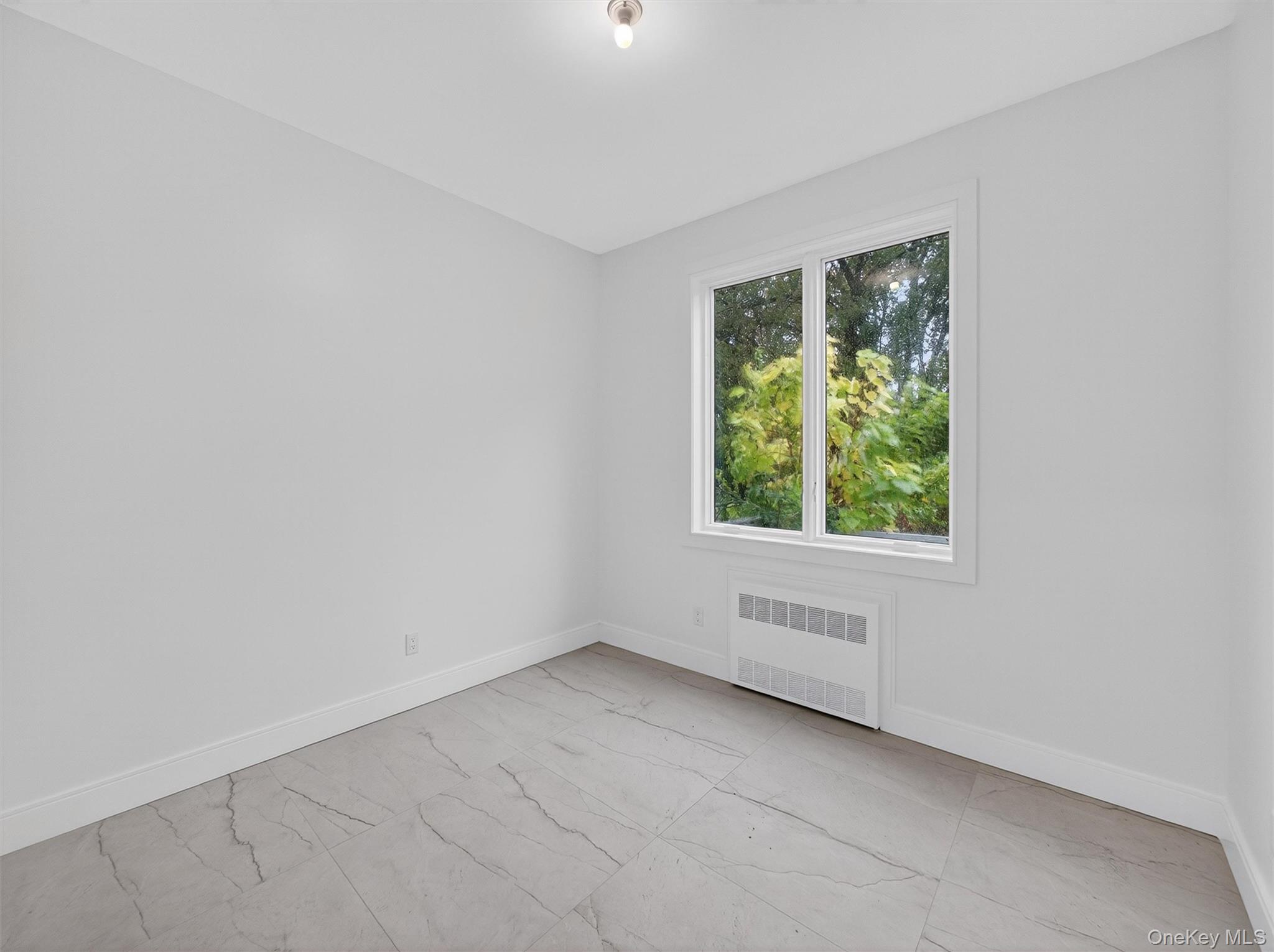 22 Johnson Street Spring Valley, NY 10977 - Photo 14 of 50 an empty room with a window