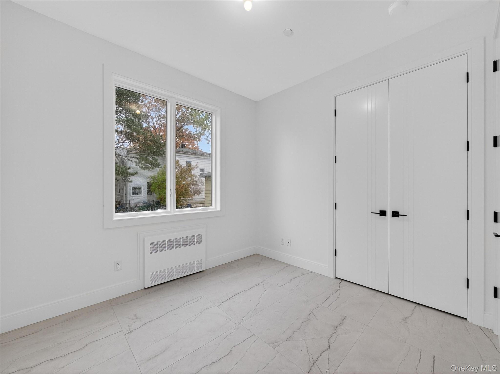22 Johnson Street Spring Valley, NY 10977 - Photo 15 of 50 a view of an empty room with a window