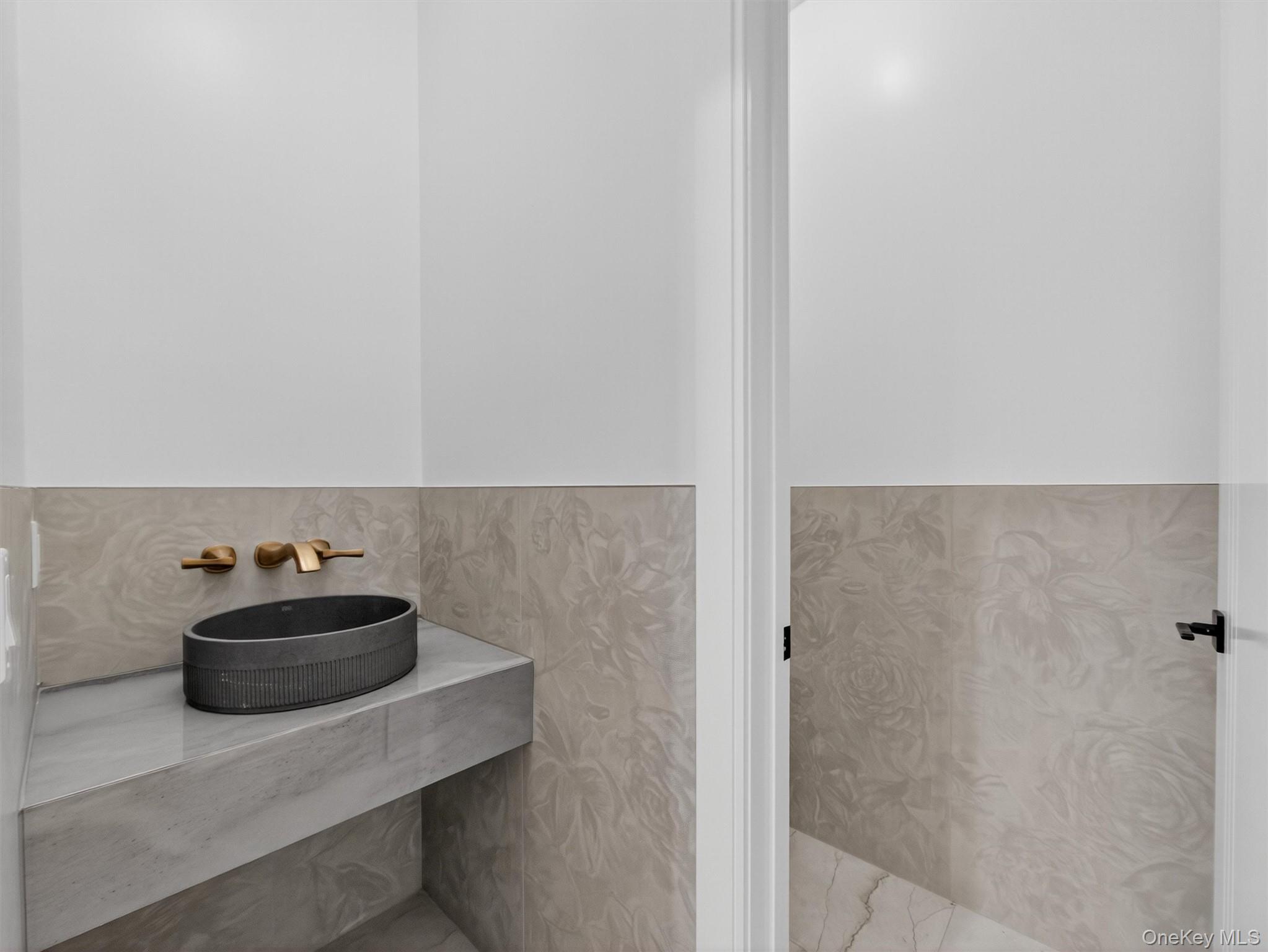 22 Johnson Street Spring Valley, NY 10977 - Photo 16 of 50 a bathroom with a sink and a mirror