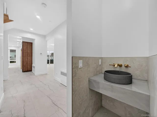 a view of a sink and cabinets