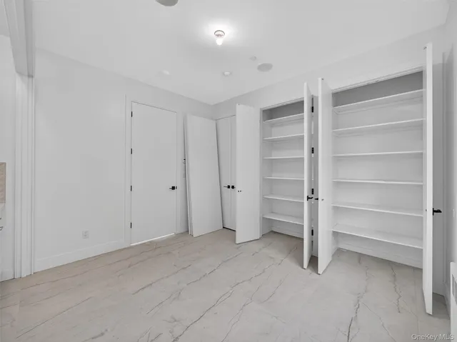 a view of an empty room with a closet