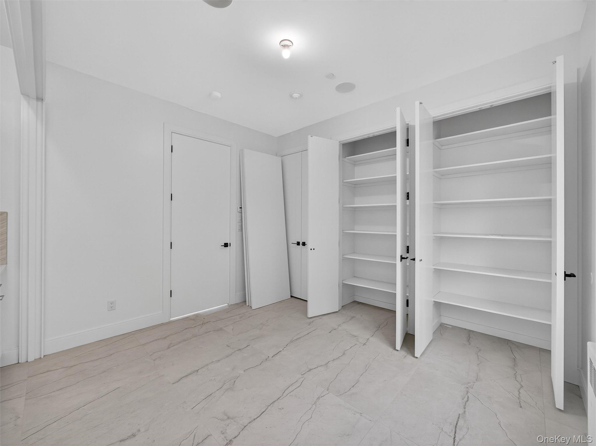 22 Johnson Street Spring Valley, NY 10977 - Photo 19 of 50 a view of an empty room with a closet