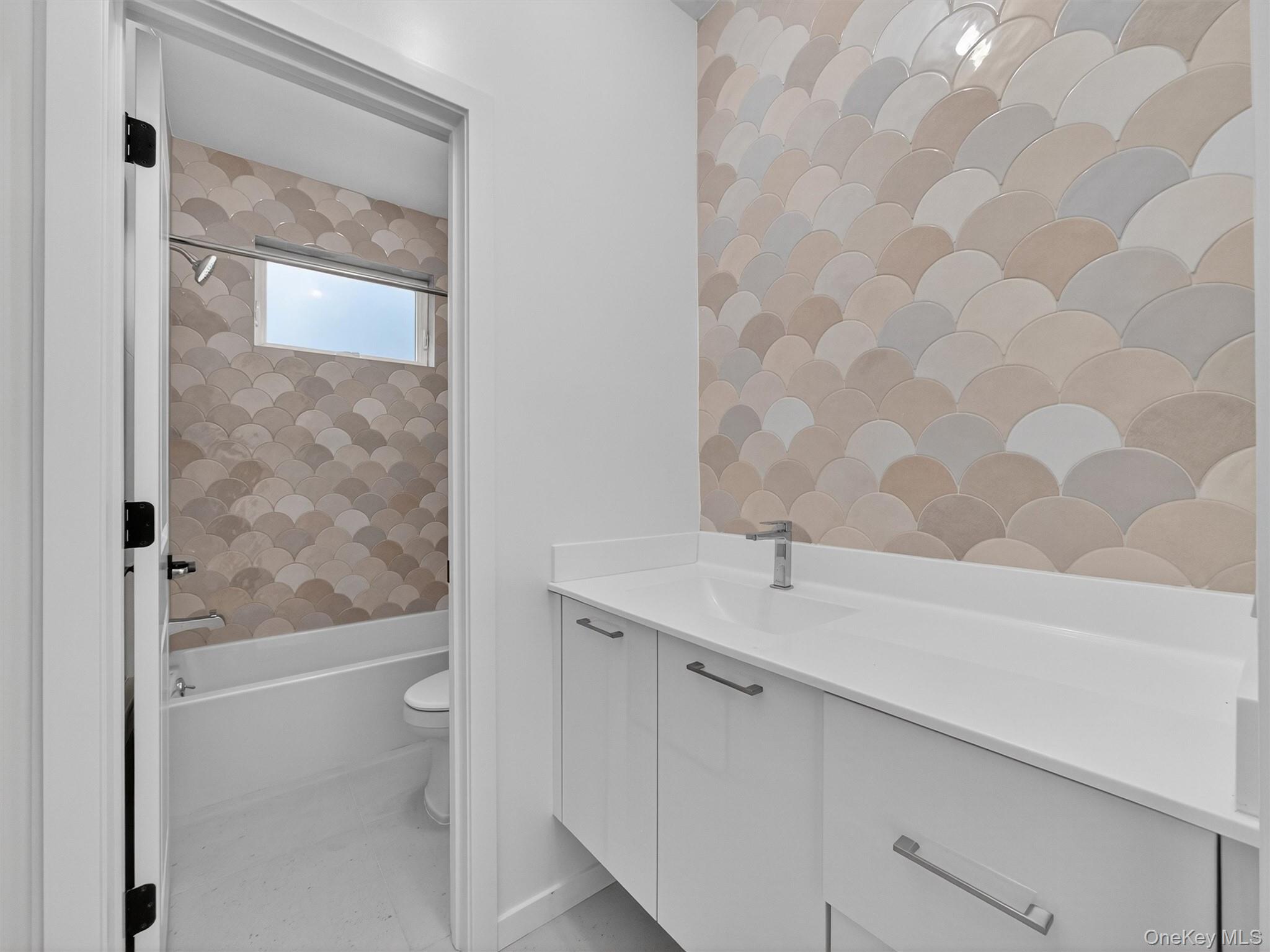 22 Johnson Street Spring Valley, NY 10977 - Photo 27 of 50 a bathroom with a granite countertop bathtub shower sink and mirror