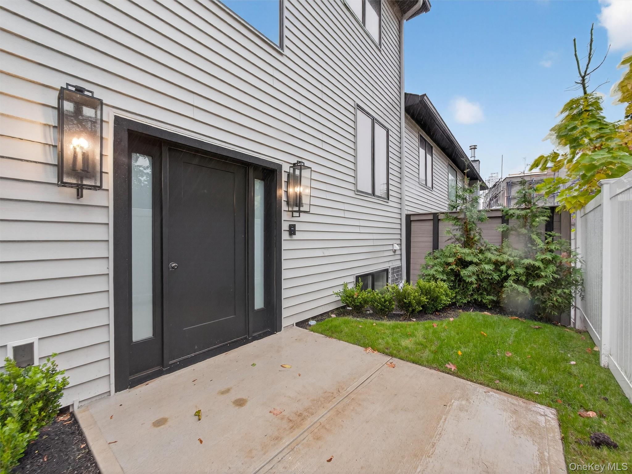 22 Johnson Street Spring Valley, NY 10977 - Photo 3 of 50 a front view of a house with garden