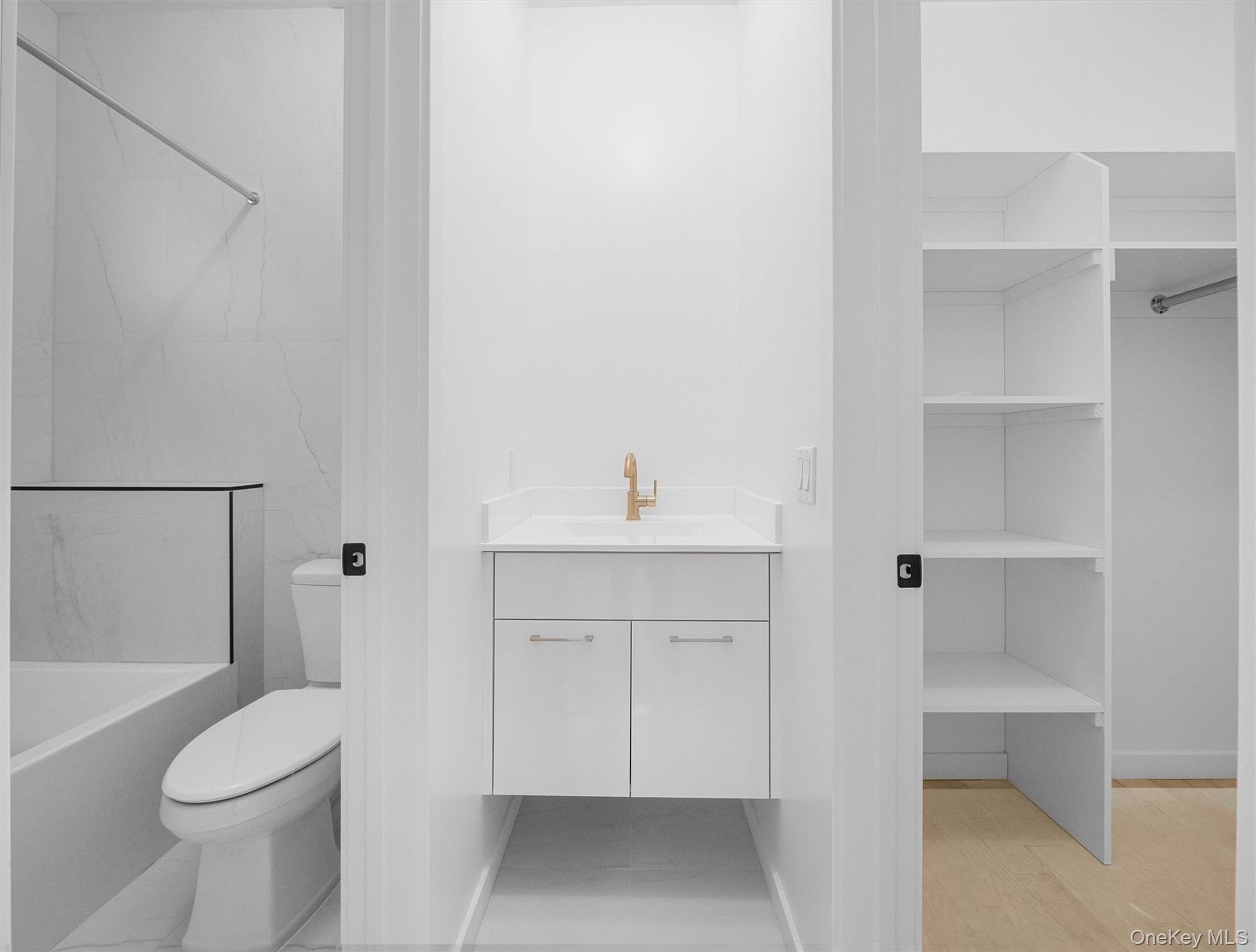 22 Johnson Street Spring Valley, NY 10977 - Photo 31 of 50 a bathroom with a sink a toilet and shower