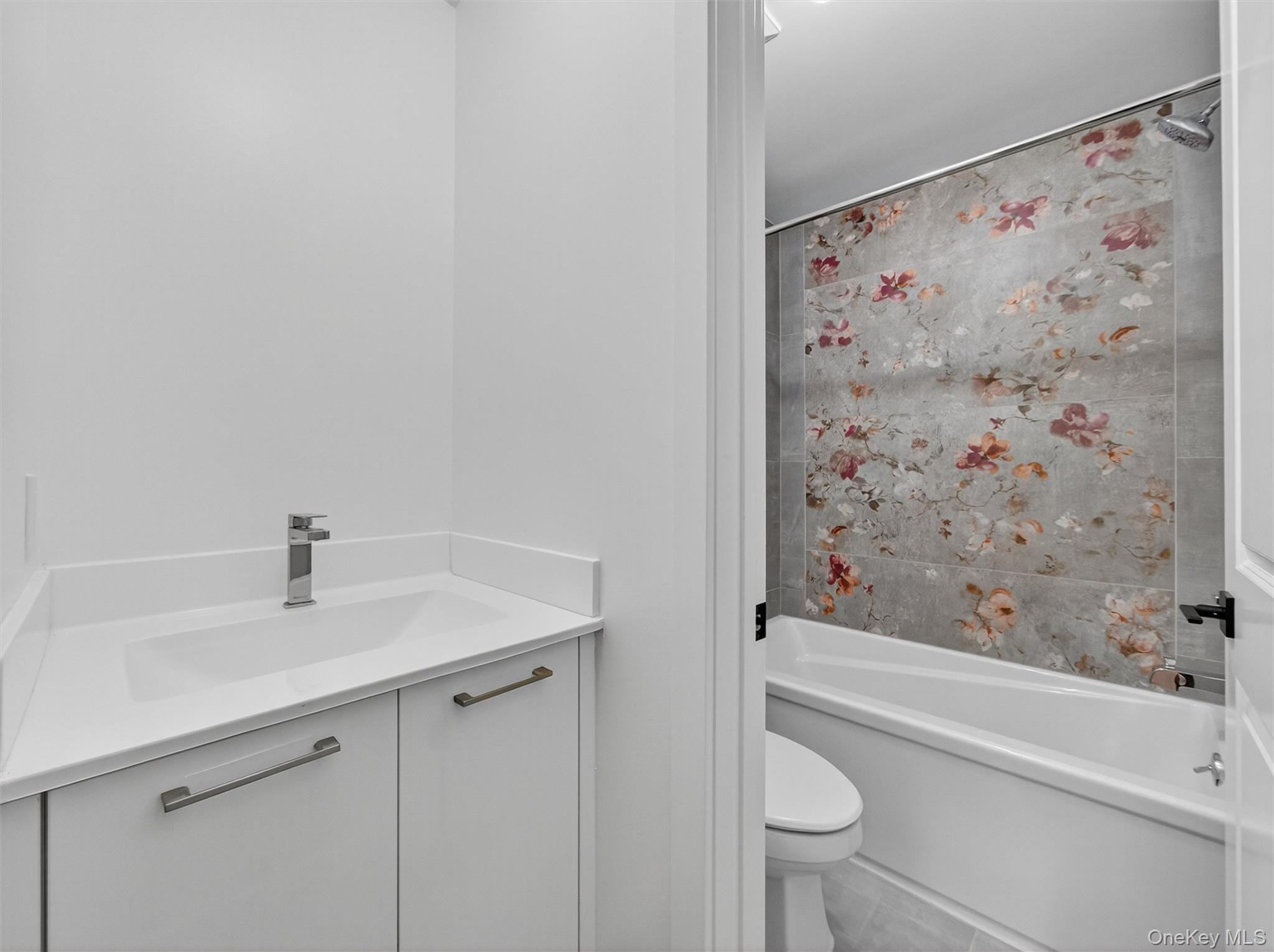 22 Johnson Street Spring Valley, NY 10977 - Photo 36 of 50 a bathroom with a sink and a mirror