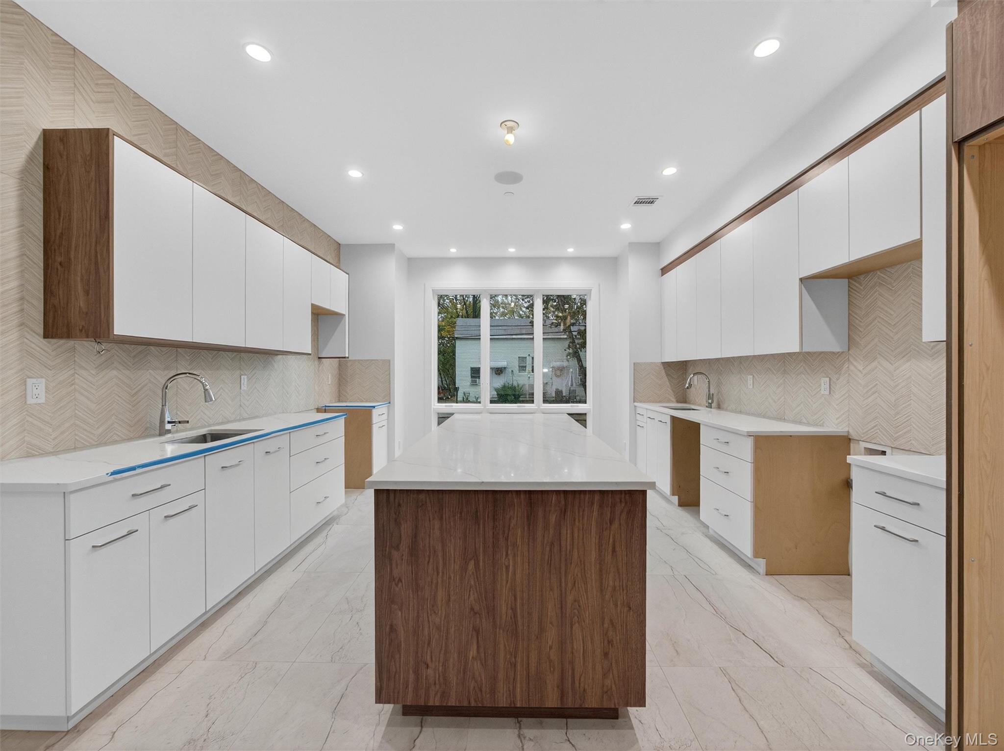 22 Johnson Street Spring Valley, NY 10977 - Photo 4 of 50 a kitchen with a sink cabinets and window