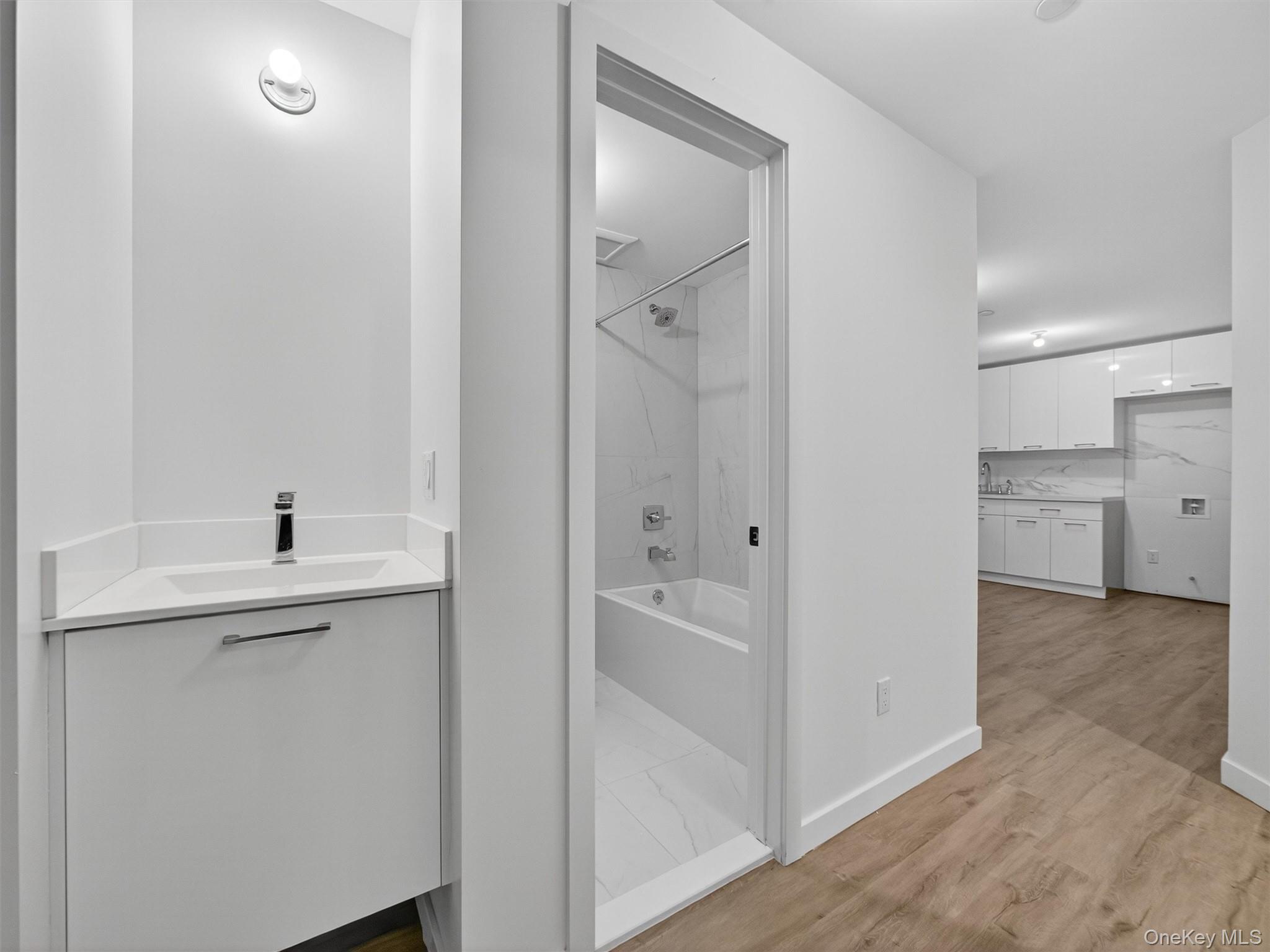 22 Johnson Street Spring Valley, NY 10977 - Photo 45 of 50 a bathroom with a sink and a mirror