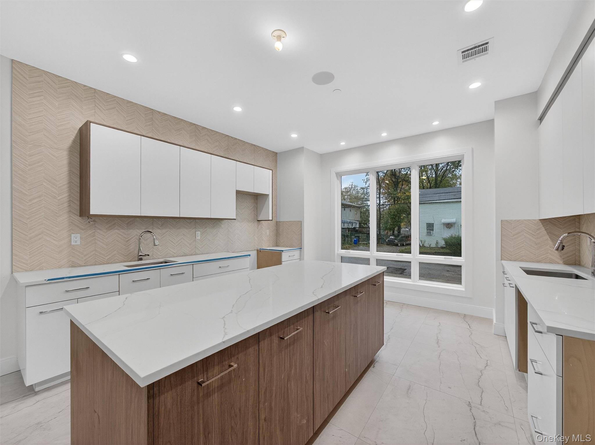 22 Johnson Street Spring Valley, NY 10977 - Photo 6 of 50 a kitchen with a sink window and cabinets