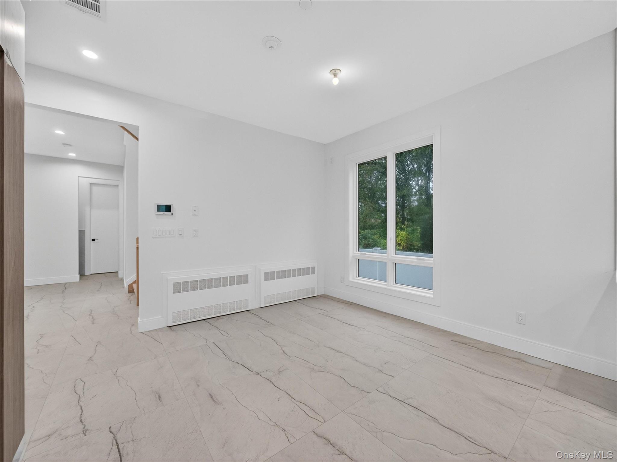 22 Johnson Street Spring Valley, NY 10977 - Photo 7 of 50 a view of an empty room with a window