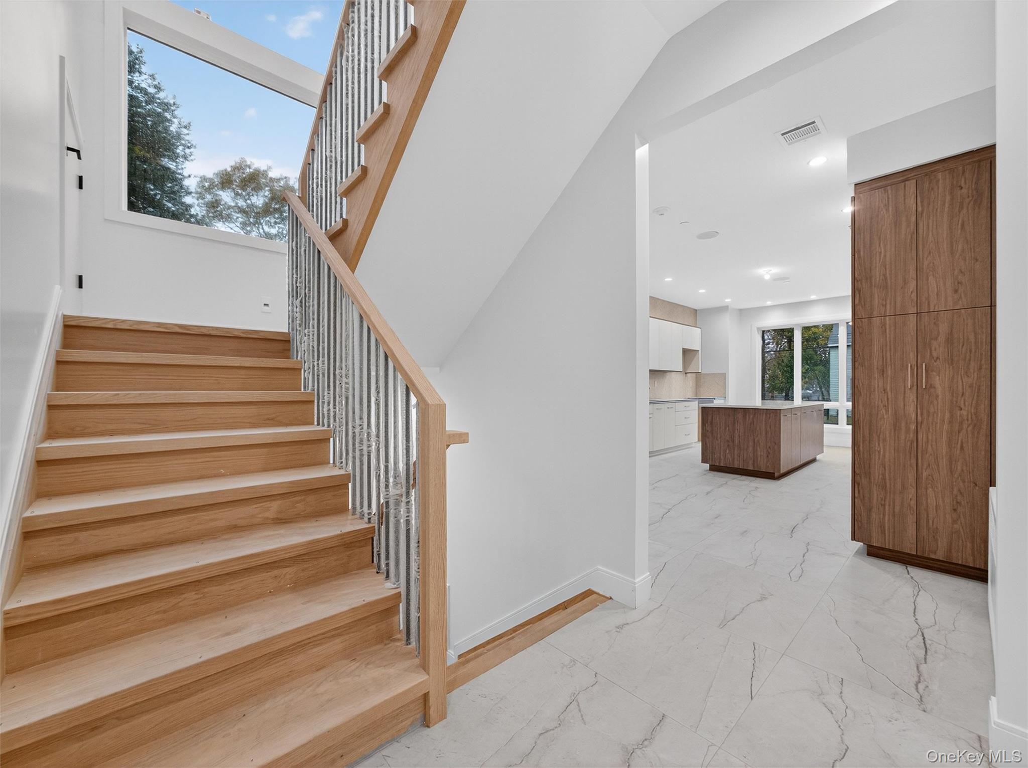 22 Johnson Street Spring Valley, NY 10977 - Photo 8 of 50 a view of a hallway with wooden floor and stairs