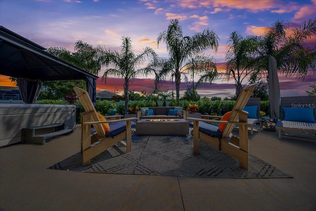 8598 Southwest 59th Terrace Ocala, FL 34476 - Photo 14 of 73 a view of a patio with a table and chairs