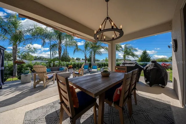 a view of a dining room with furniture window and outside view