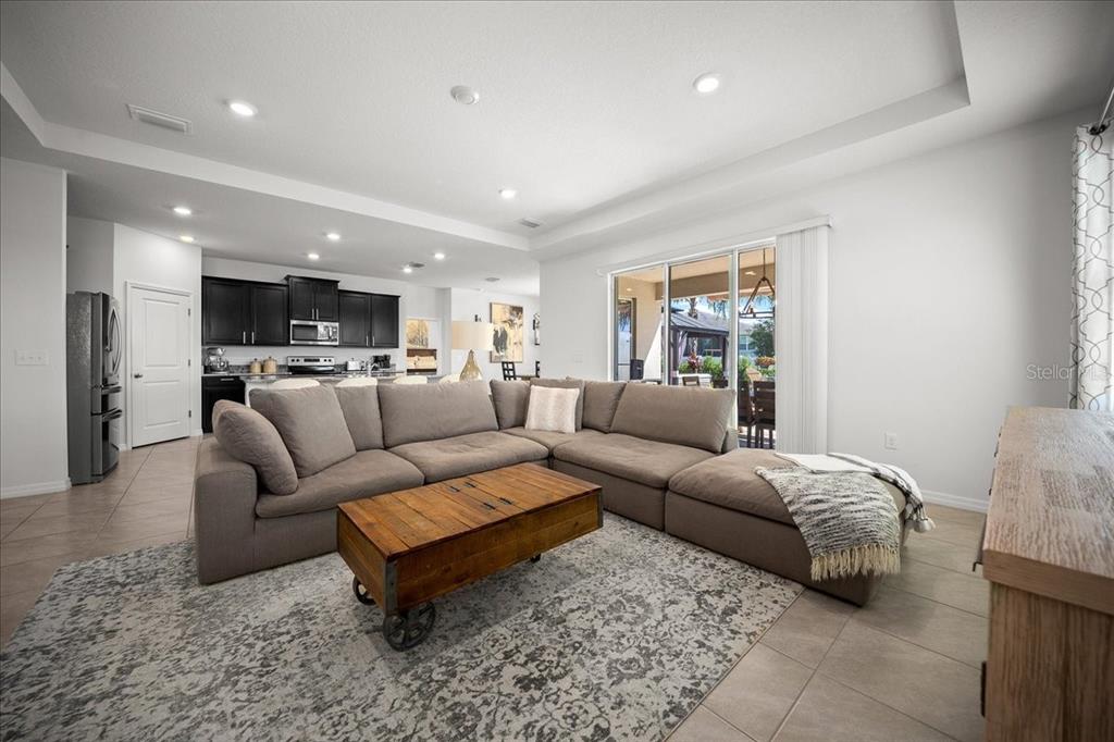 8598 Southwest 59th Terrace Ocala, FL 34476 - Photo 28 of 73 a living room with furniture and a large window