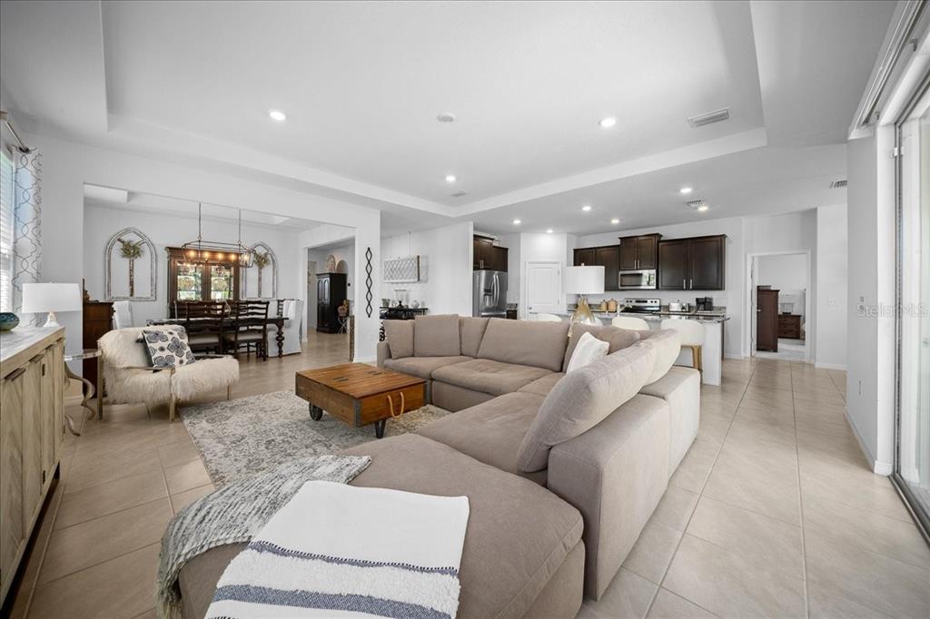 8598 Southwest 59th Terrace Ocala, FL 34476 - Photo 29 of 73 a living room with furniture and a view of kitchen