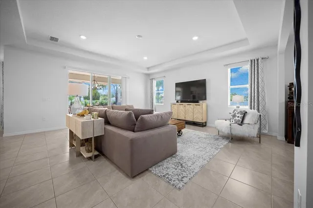 a bathroom with a granite countertop sink a mirror and a bathtub
