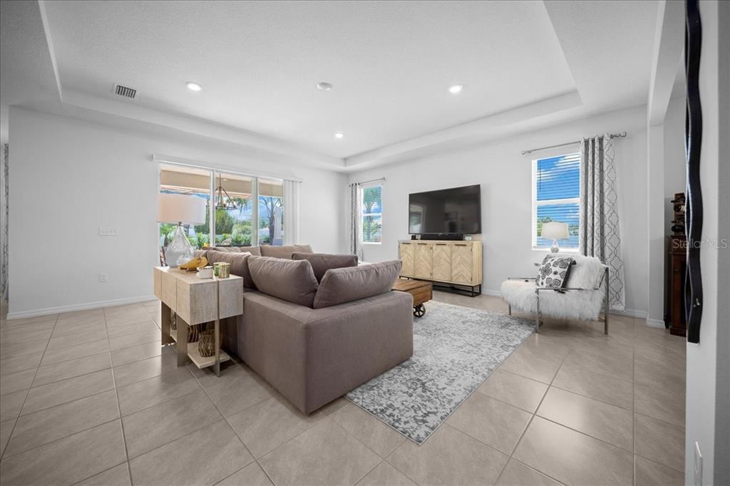 8598 Southwest 59th Terrace Ocala, FL 34476 - Photo 30 of 73 a living room with furniture and a flat screen tv