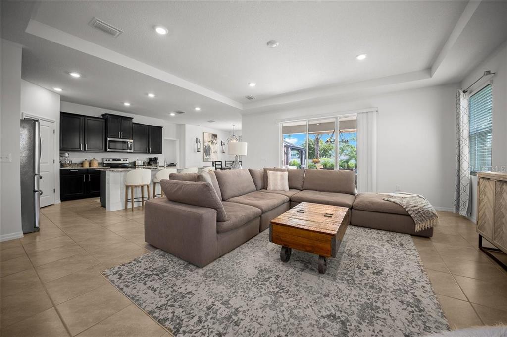 8598 Southwest 59th Terrace Ocala, FL 34476 - Photo 31 of 73 a living room with furniture and a wooden floor