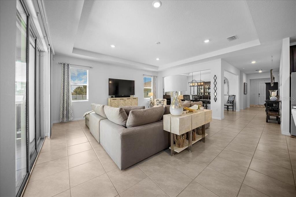 8598 Southwest 59th Terrace Ocala, FL 34476 - Photo 32 of 73 a living room with furniture and a flat screen tv