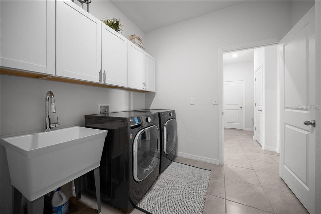 8598 Southwest 59th Terrace Ocala, FL 34476 - Photo 33 of 73 a utility room with sink dryer and washer