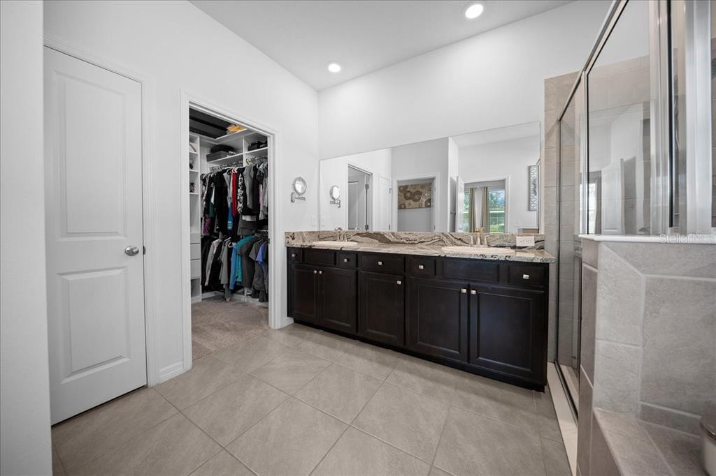 8598 Southwest 59th Terrace Ocala, FL 34476 - Photo 40 of 73 a room with a large closet and mirror