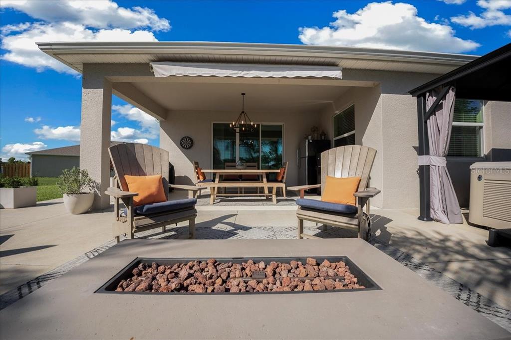 8598 Southwest 59th Terrace Ocala, FL 34476 - Photo 4 of 73 a living room with furniture and a rug