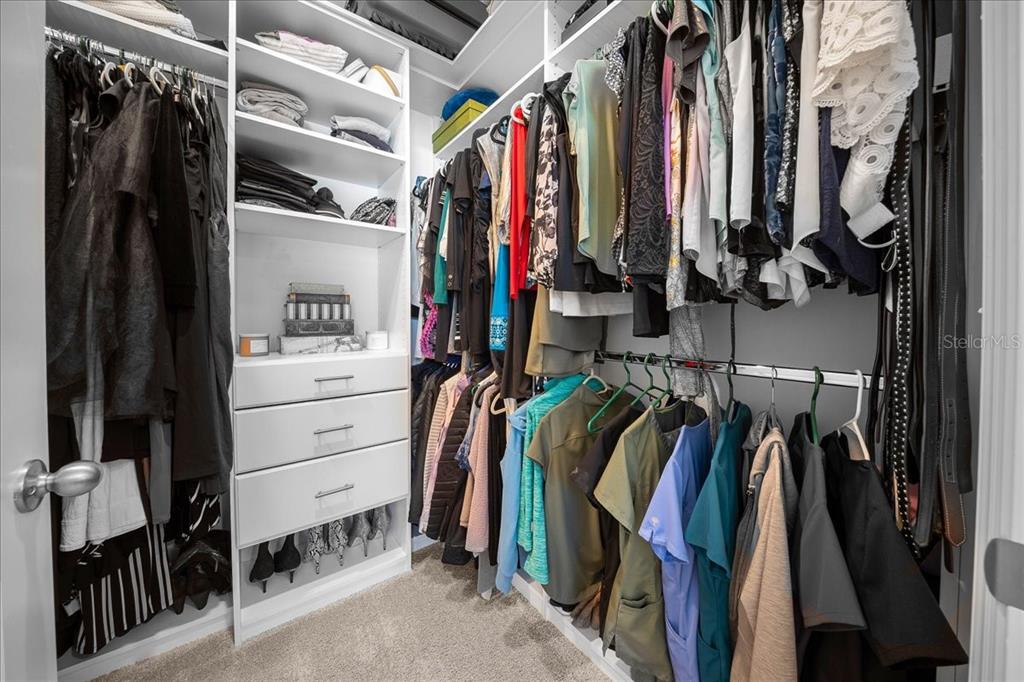 8598 Southwest 59th Terrace Ocala, FL 34476 - Photo 43 of 73 a view of walk in closet with clothes and shoes